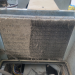 Half cleaned filthy AC evaporator coil